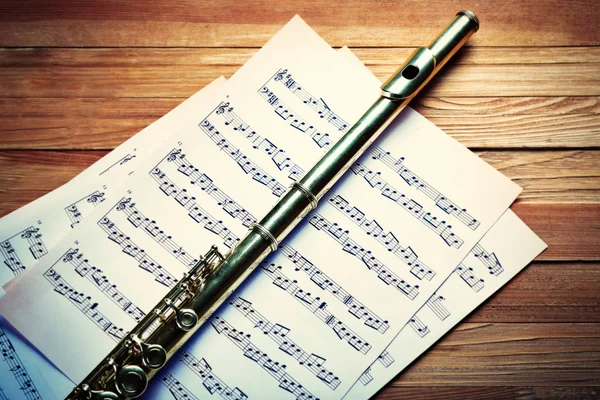Flute on musical notes
