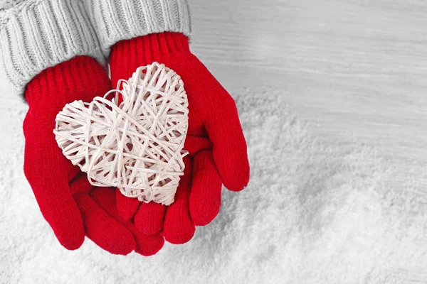 Hands in warm red gloves