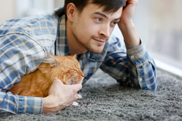 Man with fluffy cat