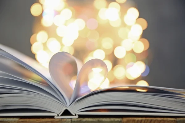 Sheets of book curved into heart shape