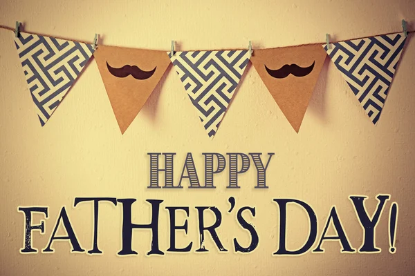 Happy Father\'s Day. Triangle garland with mustache and pattern hanging on wall