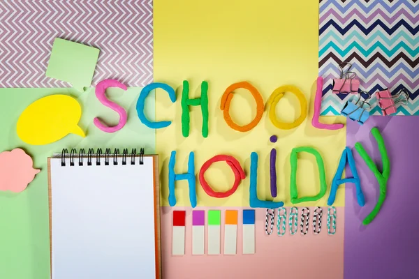 Inscription SCHOOL HOLIDAY of colorful plasticine