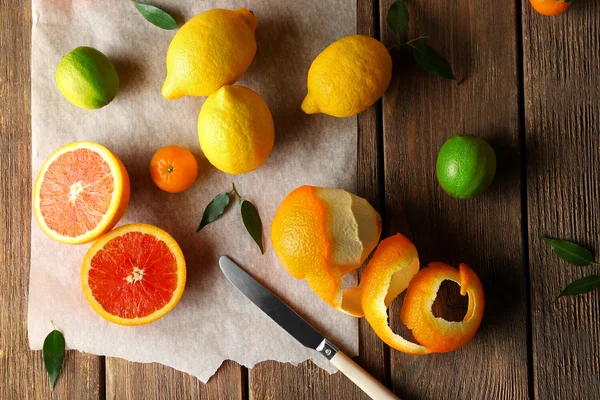 Mix of citrus fruits on wooden table