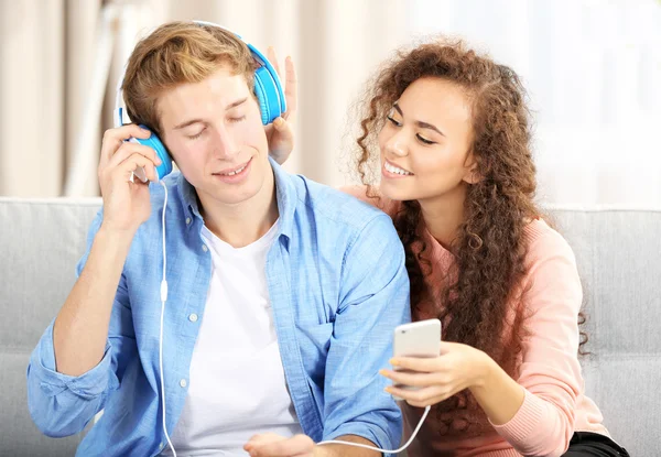 Teenager couple listening to music