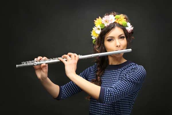 Young woman with flute