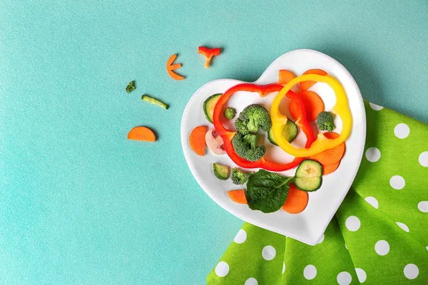 Vegetables on a plate in the form of heart