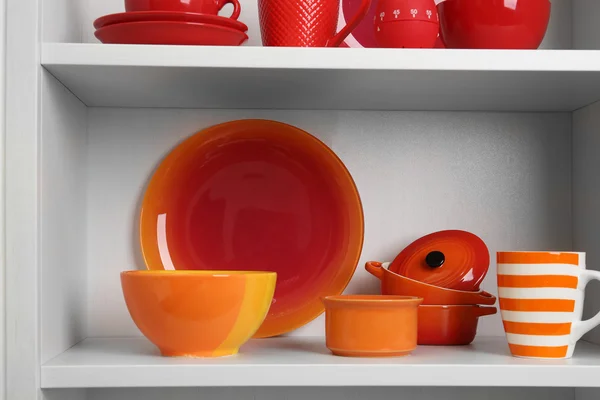 Tableware on shelves in the kitchen