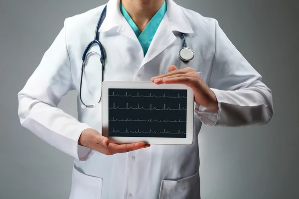 Doctor holding tablet in hands