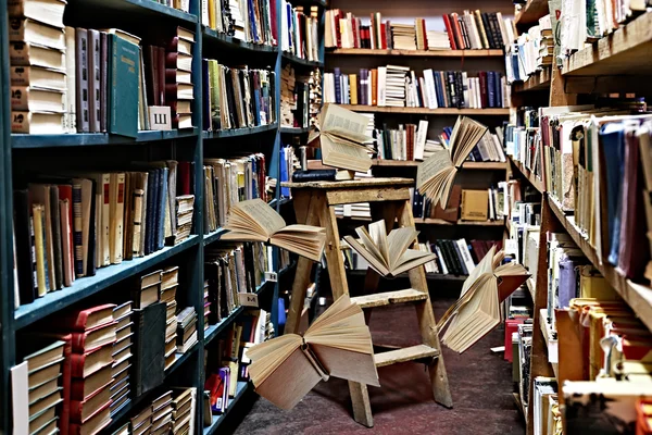 Flying books on library bookshelves