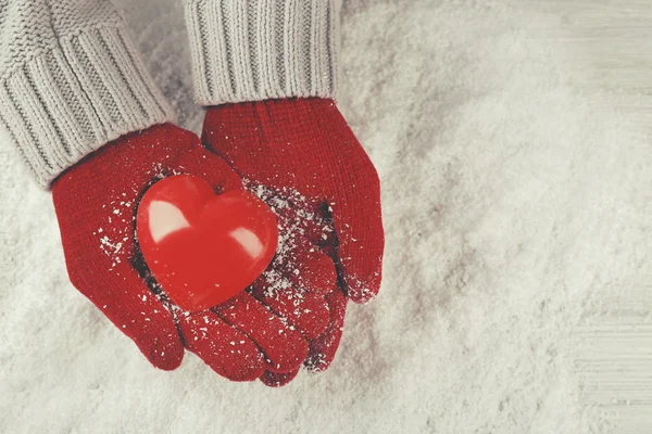 Hands in warm red gloves