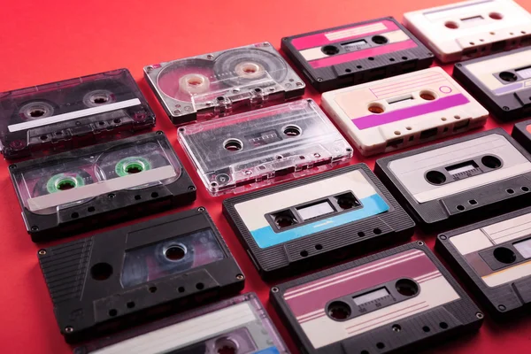 Set of old audio cassettes on red