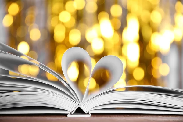 Sheets of book curved into heart shape