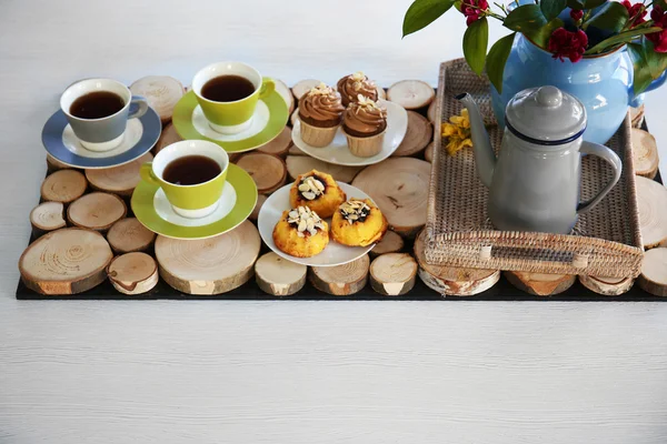 Table setting with tea and cakes