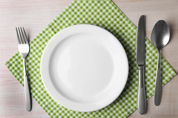 Empty plate with silver cutlery