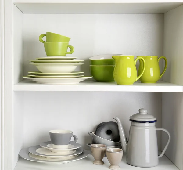 Tableware on shelves in the kitchen