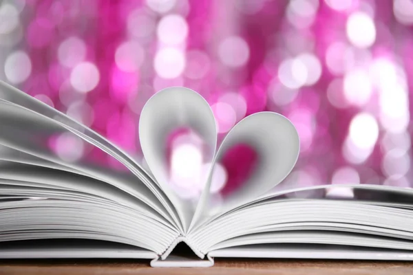 Sheets of book curved into heart shape