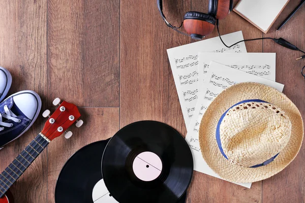 Small guitar, headphones, vinyl records