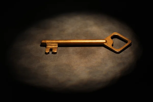 Old key on dark surface