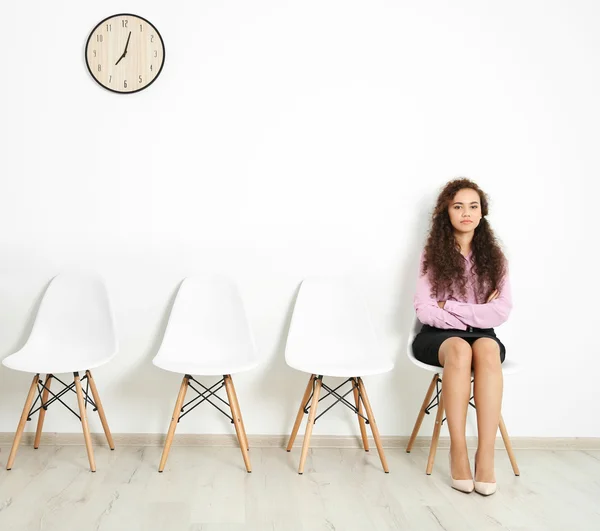Woman waiting for interview indoors