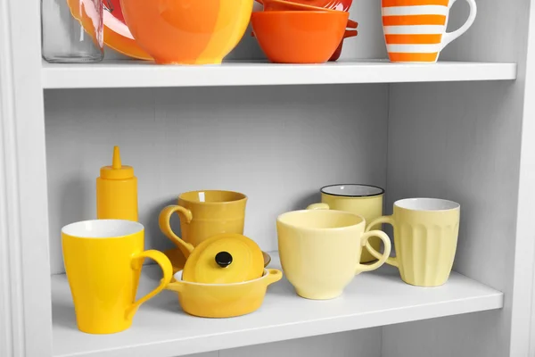 Tableware on shelves in the kitchen