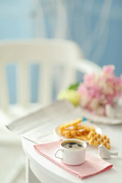 Cup of coffee with wafers