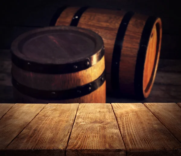 Barrels of wine and wooden desk