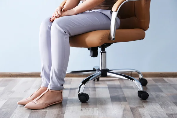 Woman sitting on the office chair