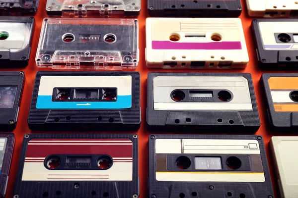Set of old audio cassettes on red