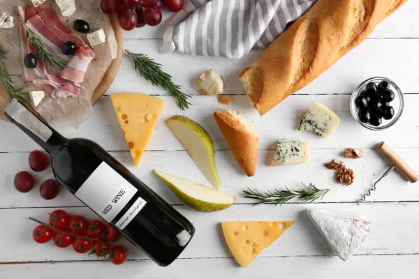 Wine, snacks and different cheese