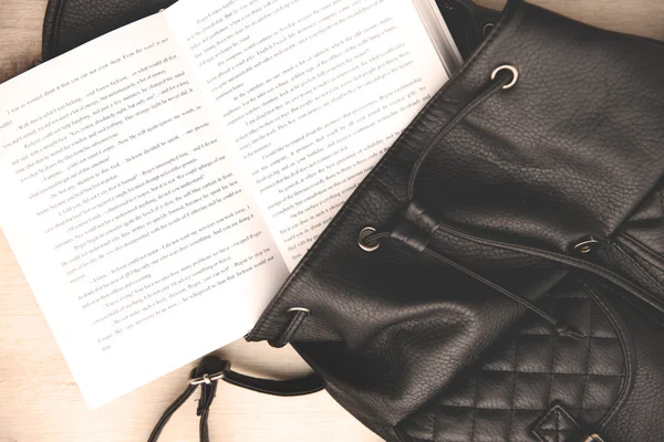 Leather backpack and book