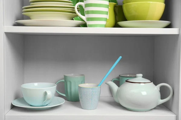 Tableware on shelves in the kitchen