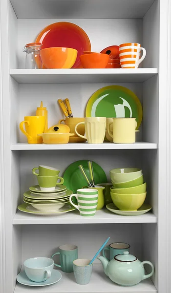 Tableware on shelves in the kitchen
