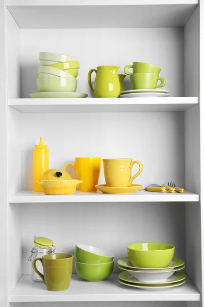 Tableware on shelves in the kitchen