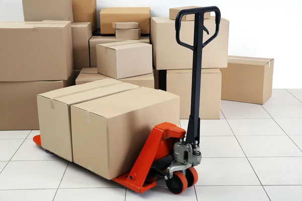 Manual pallet truck with carton boxes