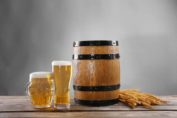 Beer barrel and glasses of beer