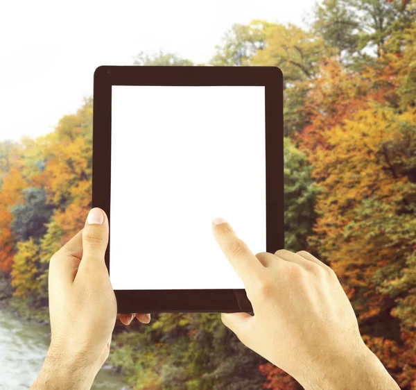 Hands holding tablet-pc with empty screen