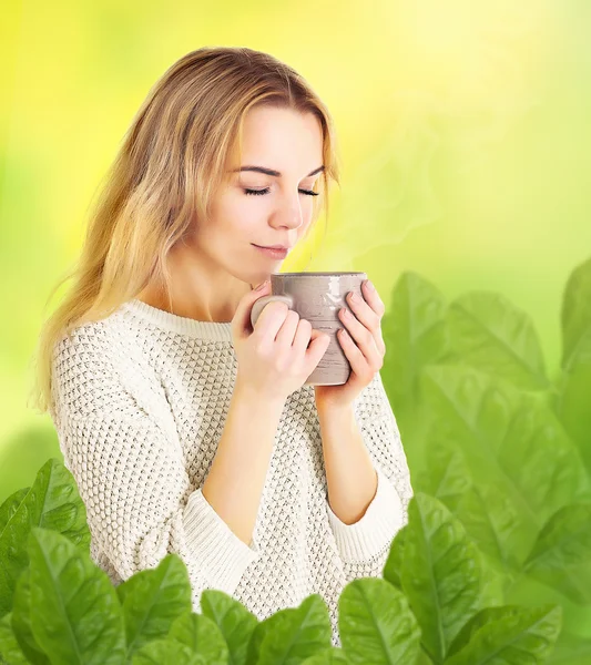 Girl enjoying cup of tea
