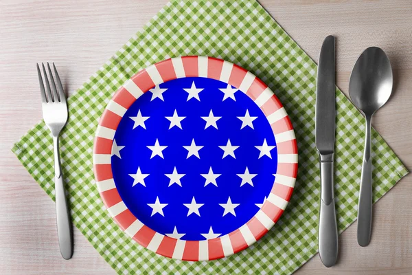 Plate with silver cutlery and napkin