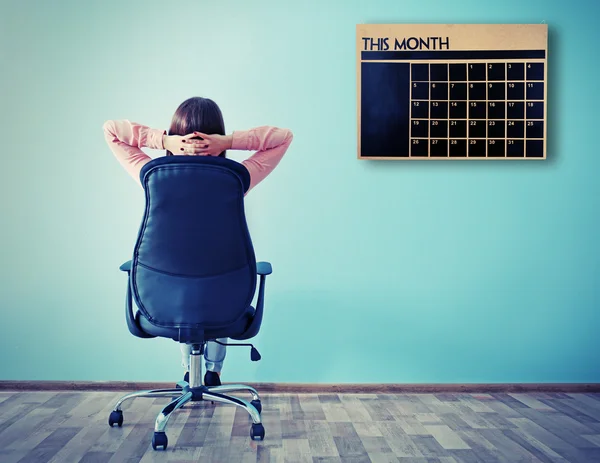 Woman sitting back on the office chair