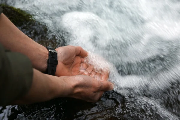 Male tourist drinking water