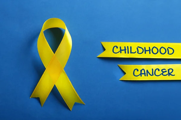 Yellow ribbon and text Childhood Cancer