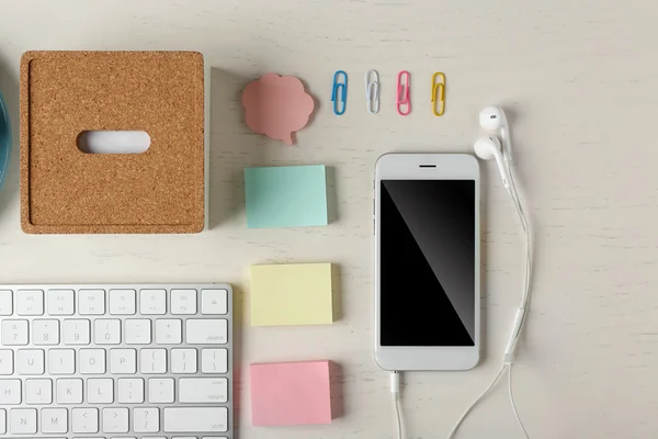 Keyboard, phone on a desk b