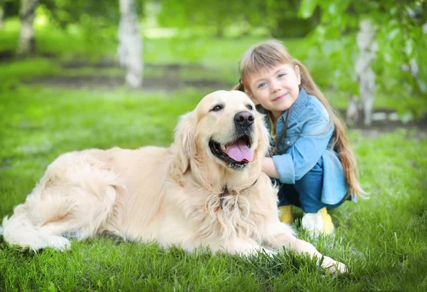 Little girl and big kind dog