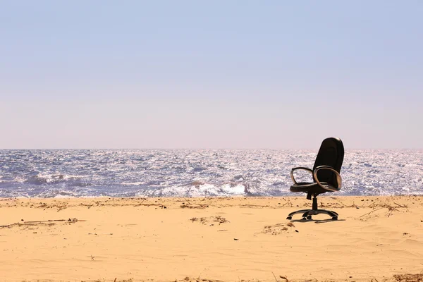 Office chair on the beach
