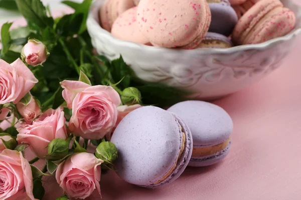 Tasty macaroons with beautiful roses