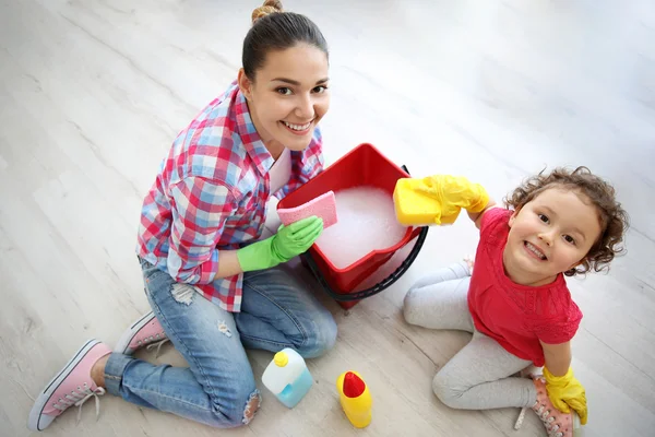 Happy family cleaning home