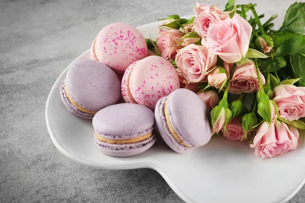 Tasty macaroons with roses