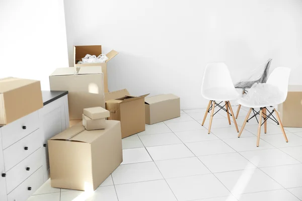Moving cardboard boxes in office space