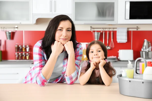 Daughter and mother in kitchen