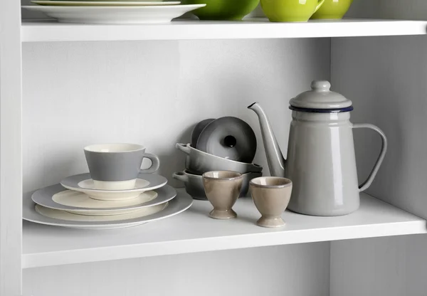 Tableware on shelf in the kitchen